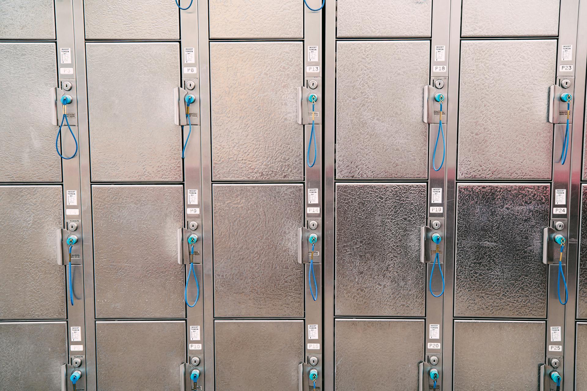 Rows of Shiny Metal Lockers with Blue Keys