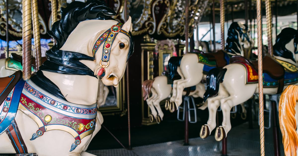 Carousel horses on a fairground ride.