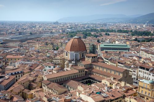Free Stunning aerial shot of Florence, Italy, showcasing its iconic architecture and red tiled roofs. Stock Photo