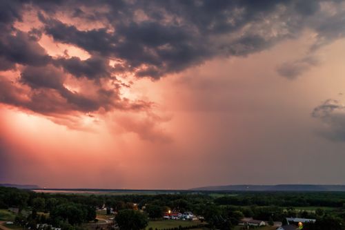 Free A breathtaking aerial view of Nelson, WI during sunset with dramatic clouds and vibrant sky hues. Stock Photo