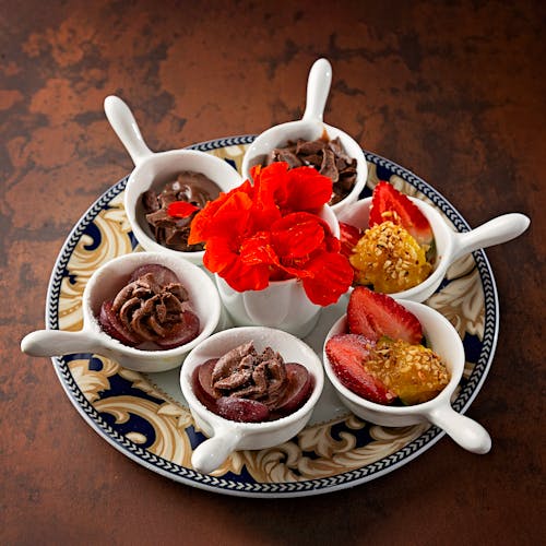 Strawberries and Chocolates in Bowls on Plate