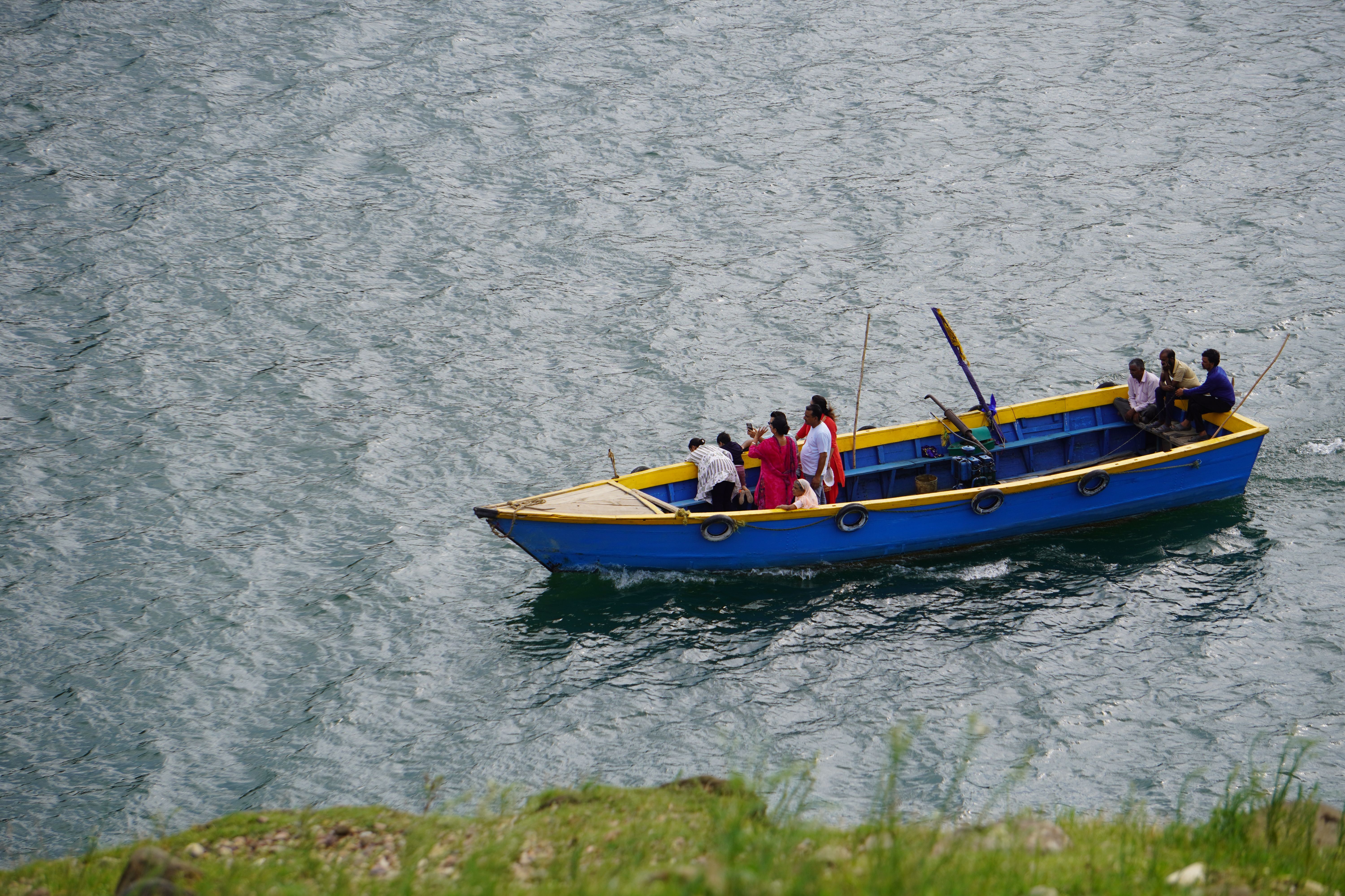 Aerial View of People in a Boat on a Body of Water · Free Stock Photo