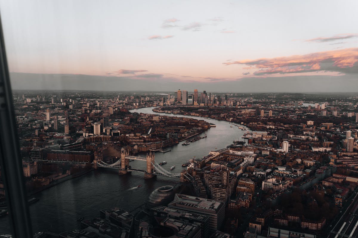 London skyline with Tower Bridge over Thames River at sunset