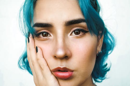 Portrait of a Young Woman with Blue Dyed Hair