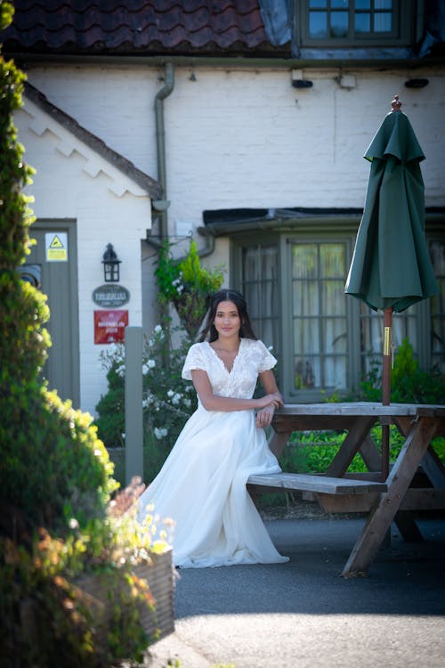 A Bride Sitting by the Picnic Table