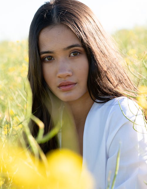 Portrait of a Young Woman on a Meadow 