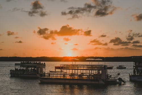 Free Ferry In Body of Water during Golden Hour Stock Photo