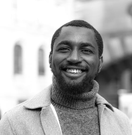 Free Smiling Man With a Beard in a Turtleneck Stock Photo