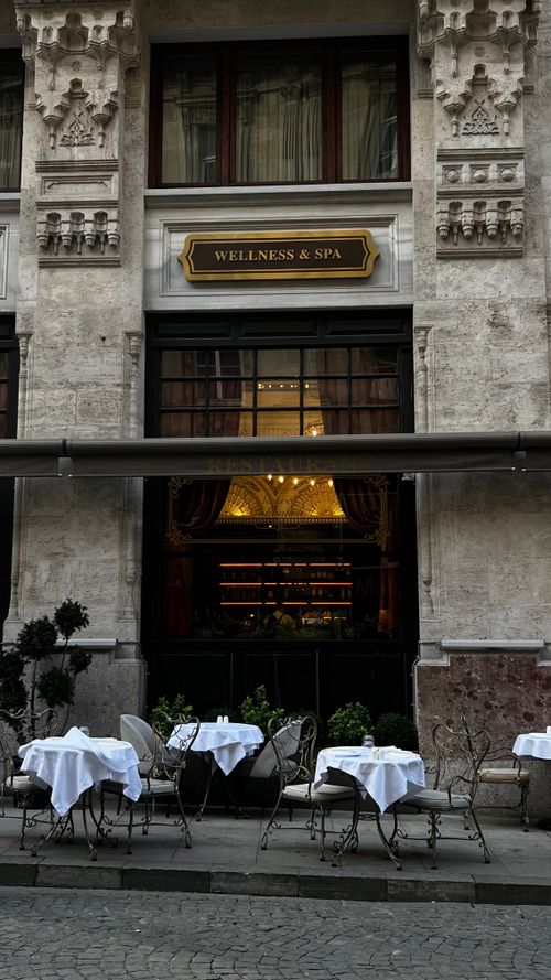 Free Charming outdoor restaurant setting with elegant tablecloths on European city street. Stock Photo