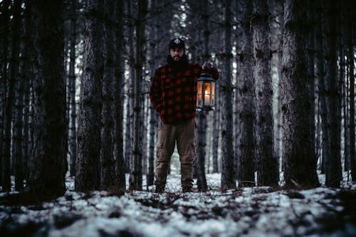 Man Holding Lantern