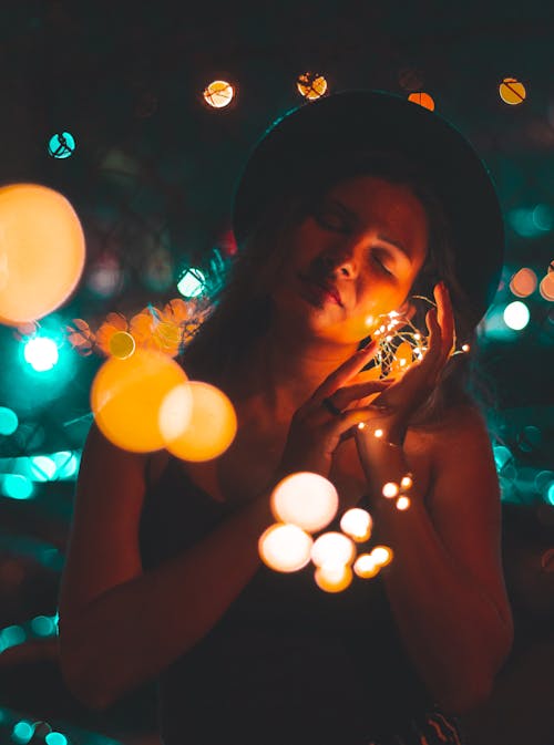 Woman Holding String Light