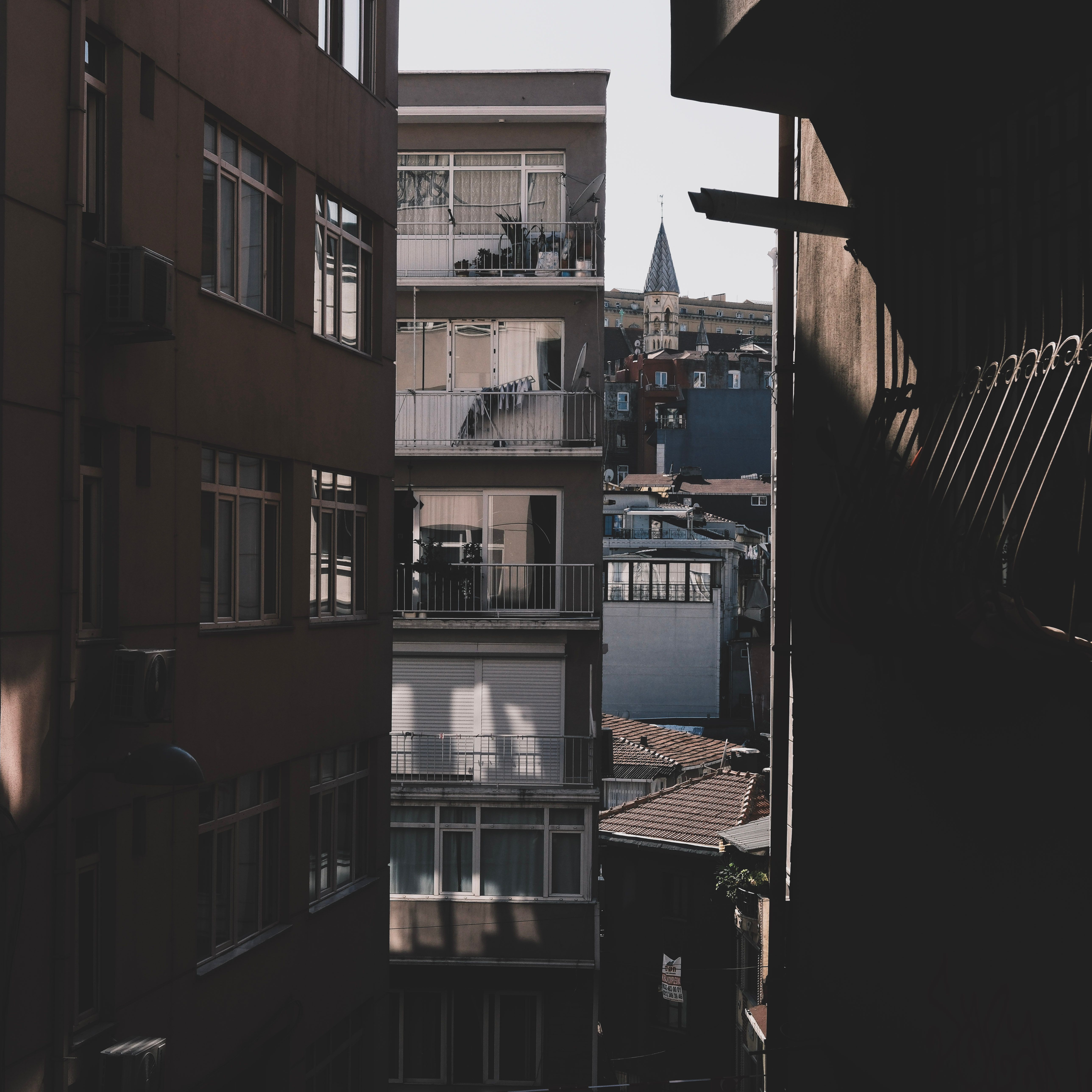 A city block of apartments with evening lights
