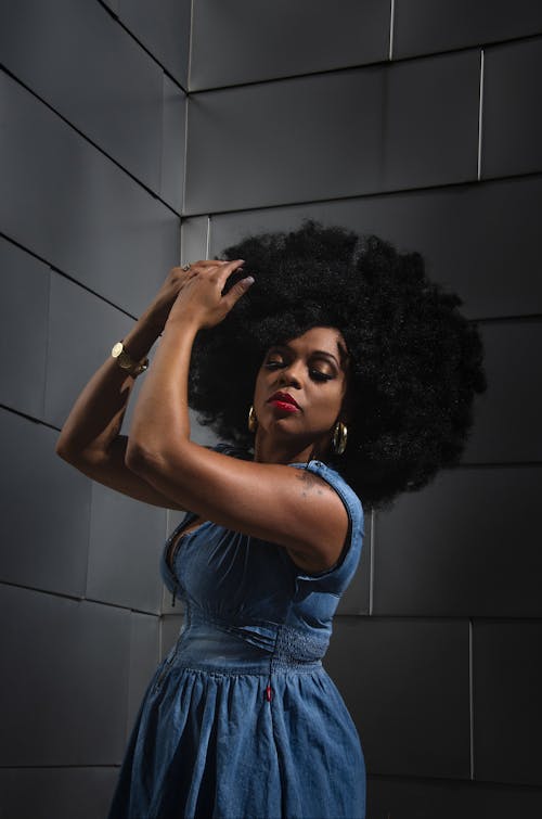 Woman with Afro Hair Wearing a Blue Dress 