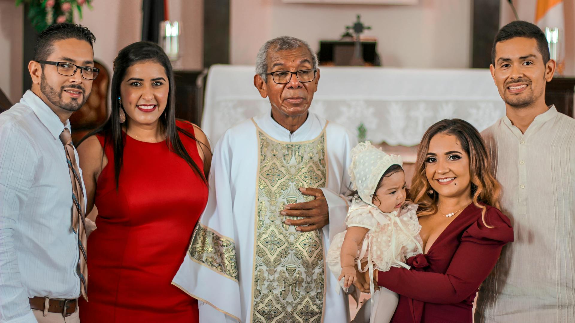 Portrait of Family with Baby and Priest in Church