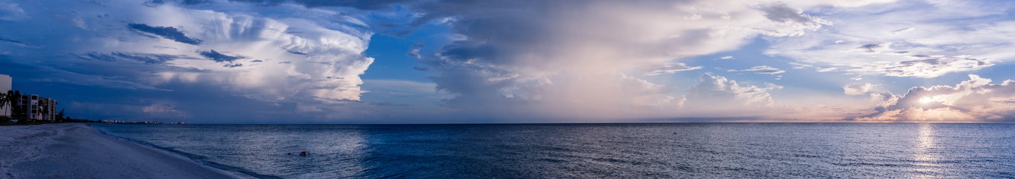 Large Body of Water Under Cloudy Sky
