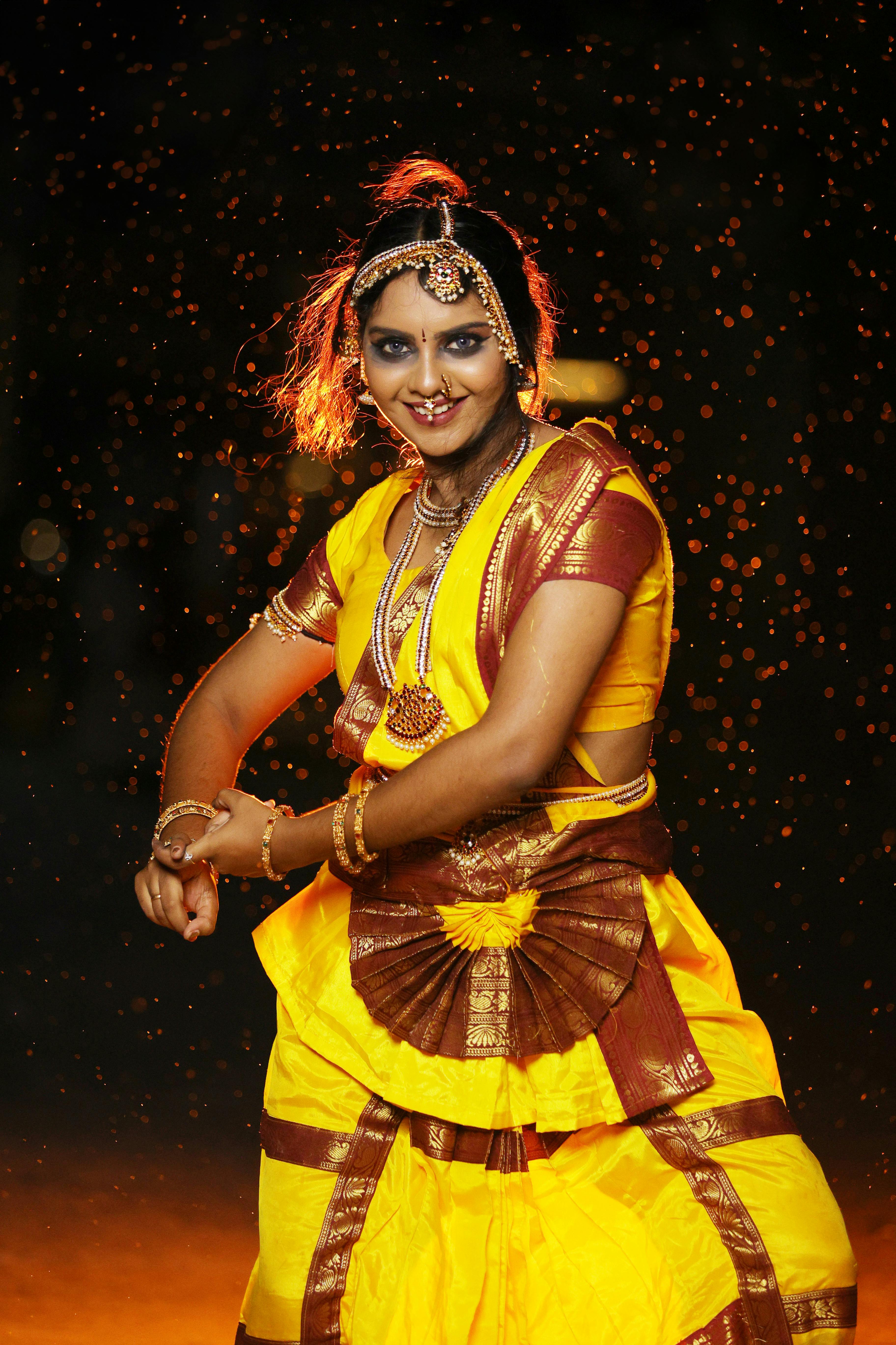 Dancer in an Indian Classical Dance Pose Wearing Traditional Costume  Consisting of a Sari Choli and a Ghungroo Anklet · Free Stock Photo