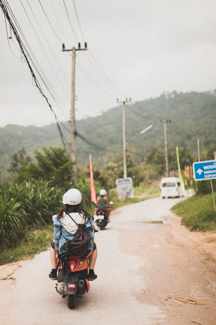 Photo Of People Riding Motorcycle