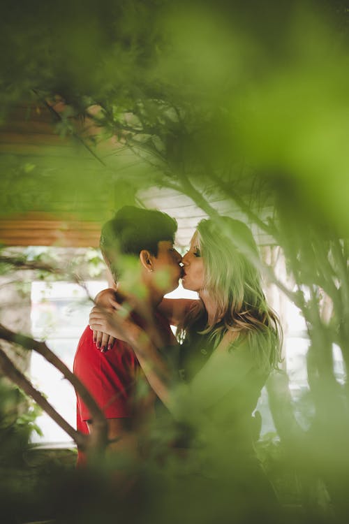 Free Selective Focus Photo of Kissing Couple Stock Photo