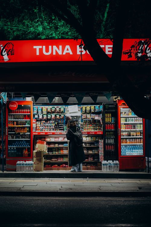 Free A person shops at a vibrant store in Ankara's urban setting. Evening atmosphere. Stock Photo