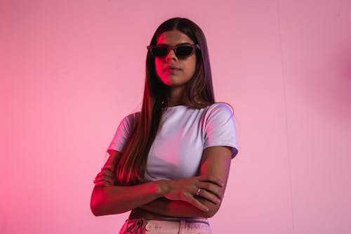 Young Woman in White Crop Top and Sunglasses