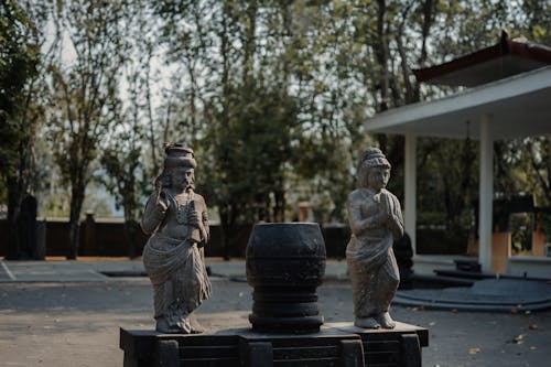 Buddhist Statues of Men in a Temple Yard