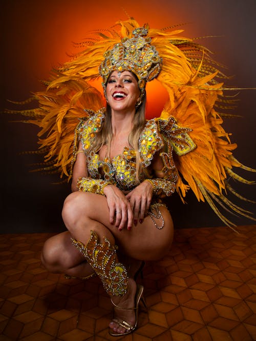 Smiling Woman Crouching in Carnival Costume