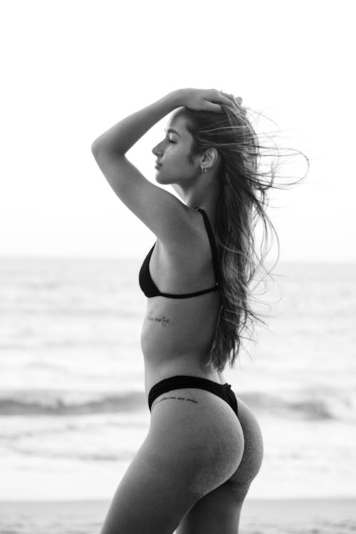 Black and White Photo of a Woman in a Bikini 