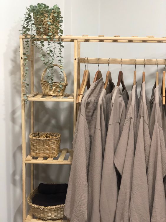 Linen Rack Model Rack with Linen Clothing · Free Stock Photo