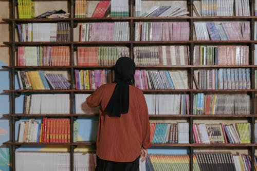 Woman Wearing Headscarf in a Library 