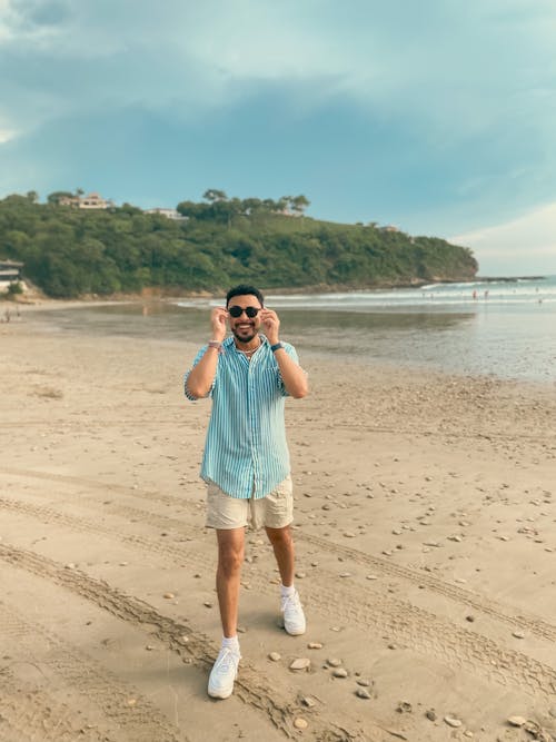 Man in Sunglasses and Shirt on Beach