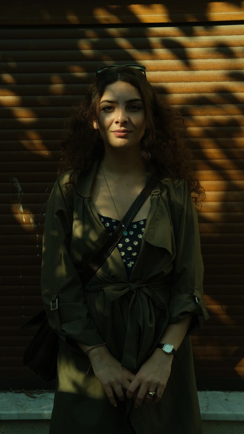 Brunette Woman Posing in Olive Trench Coat · Free Stock Photo