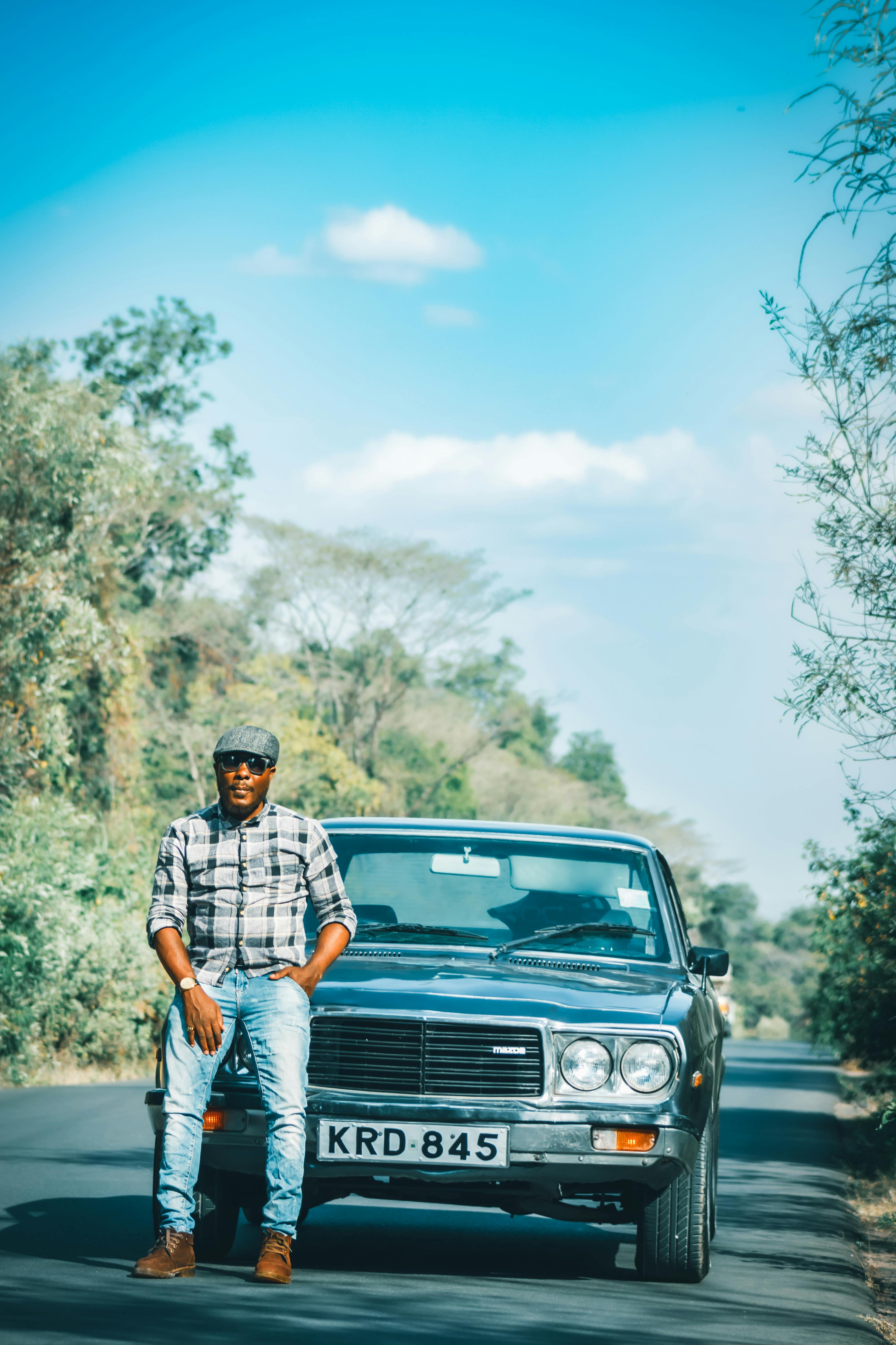 Successful arab man wear in striped shirt and sunglasses pose behind the  wheel of his white suv car. Stylish arabian men in transport. 10515318  Stock Photo at Vecteezy