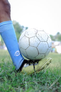 Close-up of a soccer player controlling the ball during a game in Kuttanad.