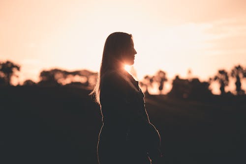 Silhouette of Woman during Golden Hour