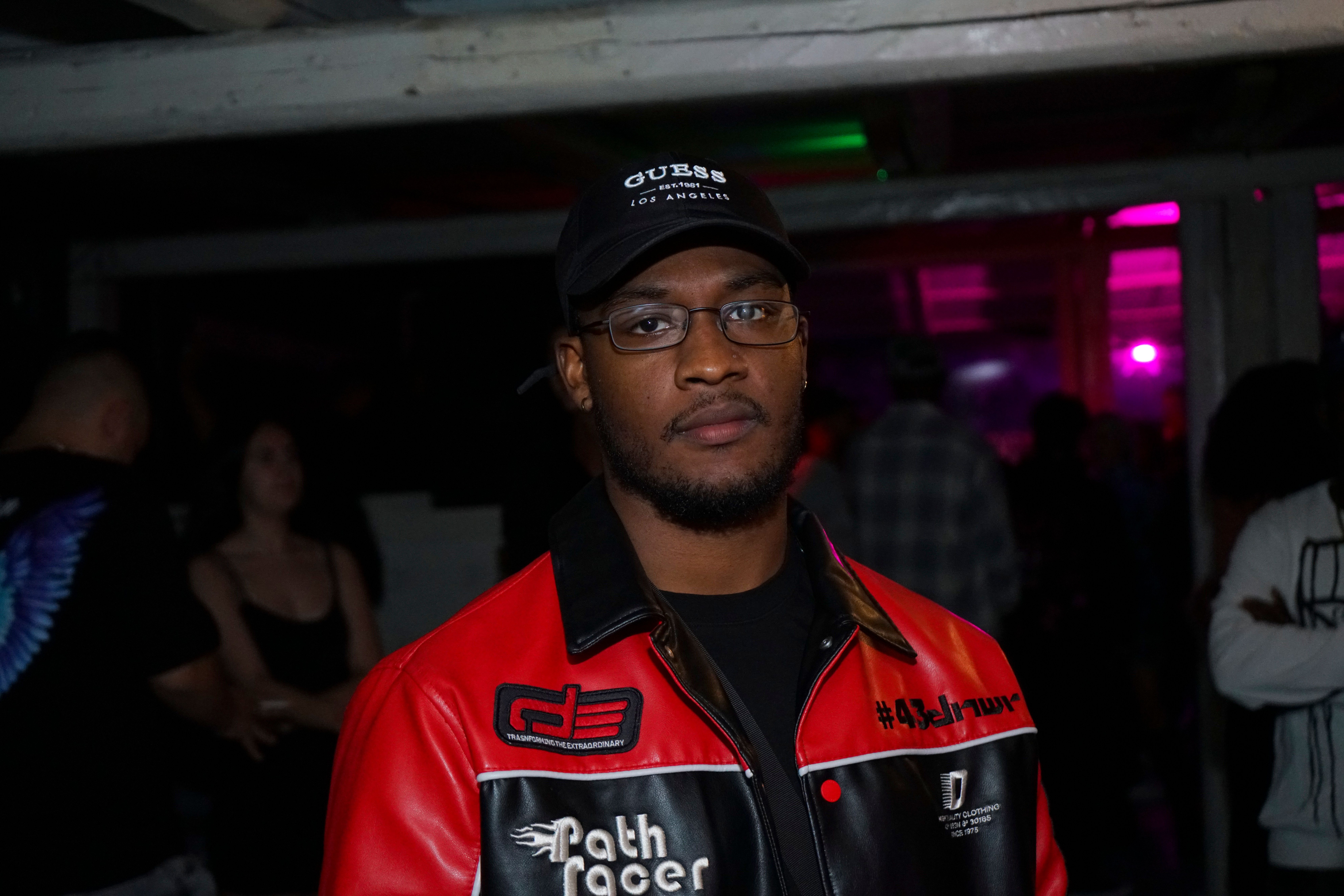 Portrait of an African Man in Racing Jacket · Free Stock Photo