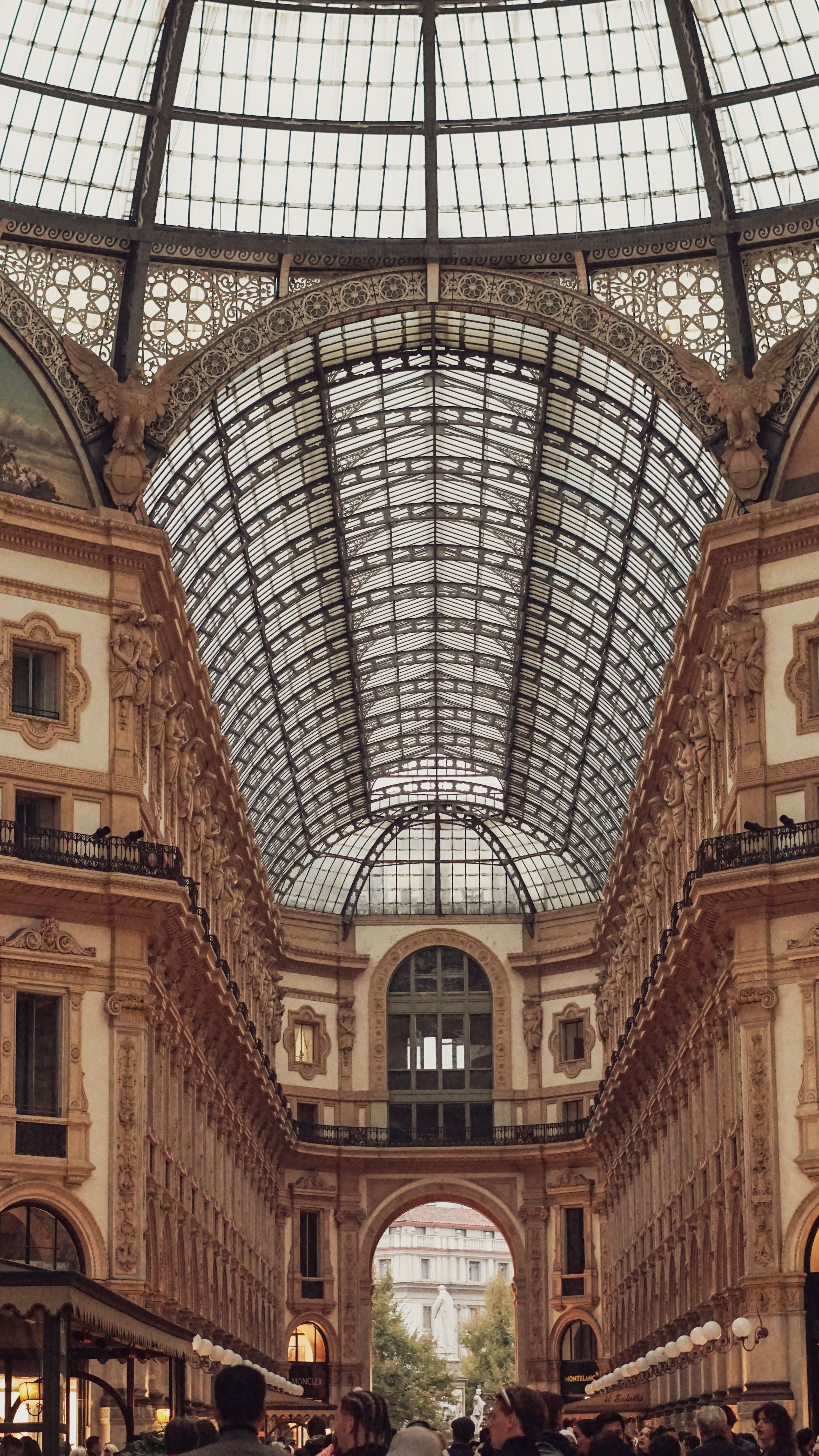 The inside of a building with a glass roof · Free Stock Photo