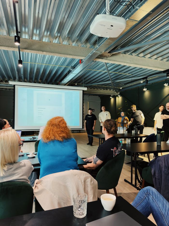 Developers collaborating in a workshop, photo by Matheus Bertelli on Pexels