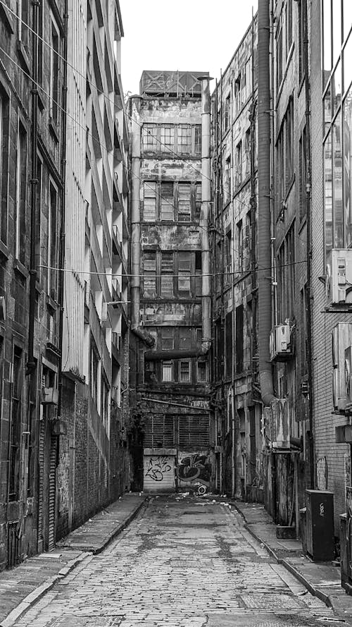 Abandoned Buildings in a Narrow Alley in Black and White