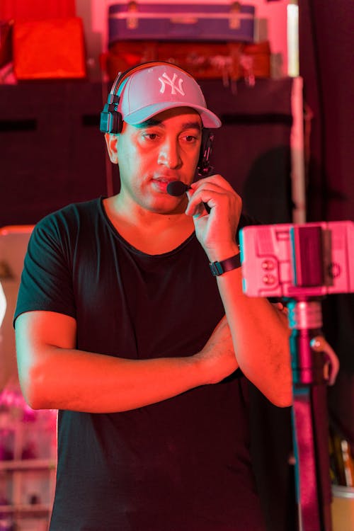 Man Holding a Microphone on a Backstage 