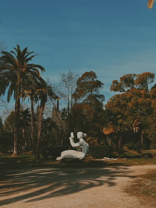 Sculpture in Park under Palm Trees