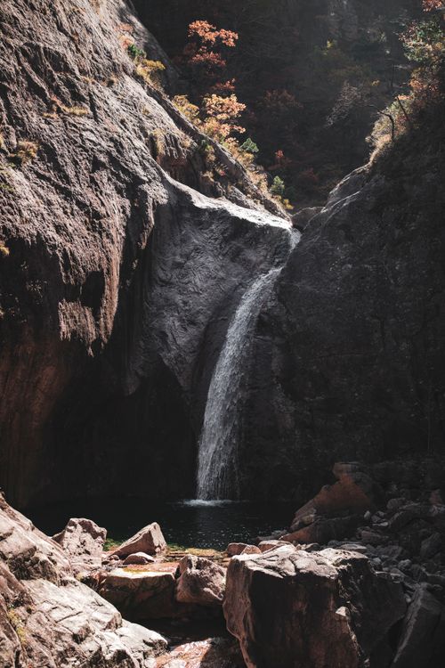 Waterfall Through Rocks Waterfall Flowing through Cracks in Rocks · Free Stock Photo