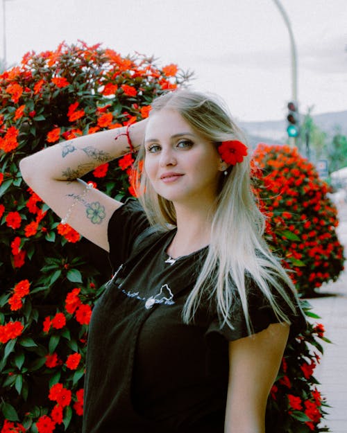 Smiling Blonde Woman with Tattoos