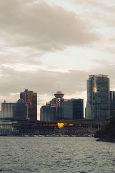 A stunning view of Vancouver's skyline from the harbor at twilight, capturing modern architecture.