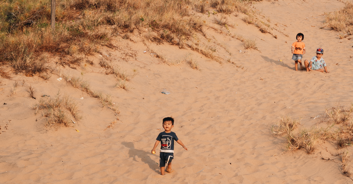 Kids Getting Sandy Children at Sandy Beach · Free Stock Photo