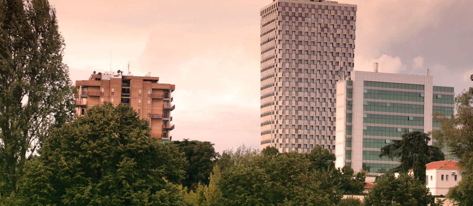 View of modern skyscrapers and lush greenery in Tirana, Albania during daylight. — flights from Bari to Tirana