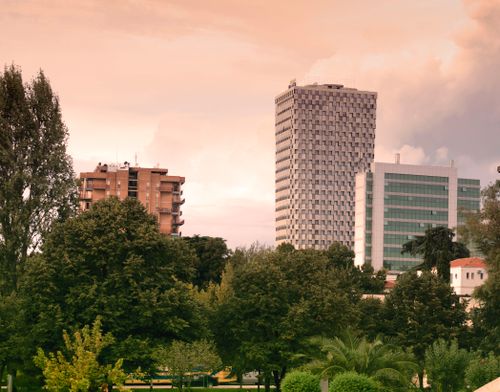 Free View of modern skyscrapers and lush greenery in Tirana, Albania during daylight. Stock Photo