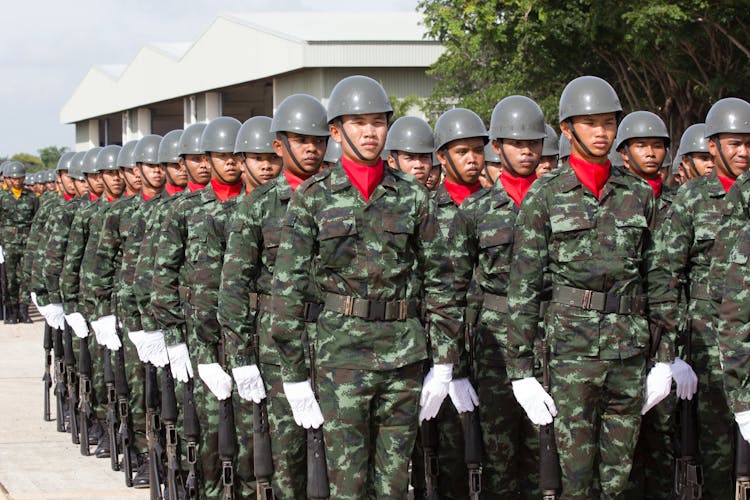 Serious Ethnic Soldiers Lining Up During Military Ceremony