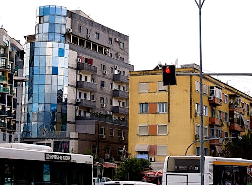 Vehicles on Road Near Building Structures