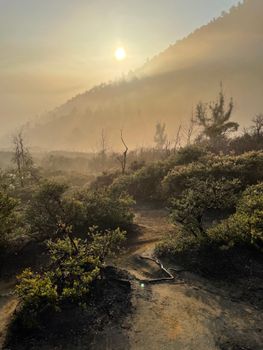 Stunning sunrise over hilly landscapes in Eastern Jakarta, Indonesia.