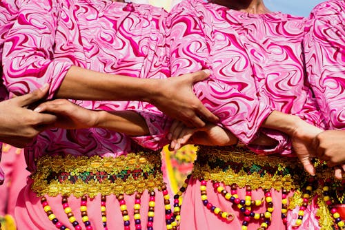 Women Wearing Colorful Costumes on a Parade